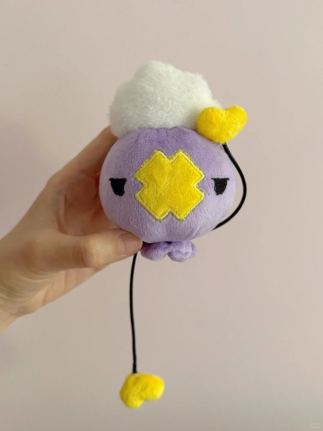 Handmade purple Drifloon plush with white cloud top and yellow heart-tipped cords