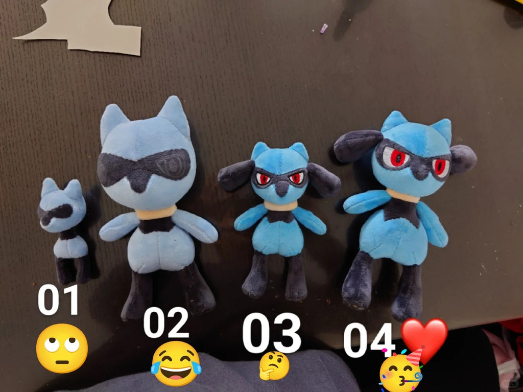 Four Lucario-inspired plush prototypes in different sizes showing the sewing pattern development process