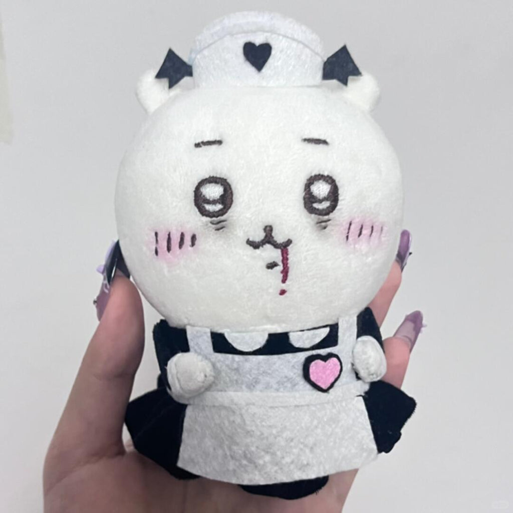 Chiikawa plush dressed in a black and white costume