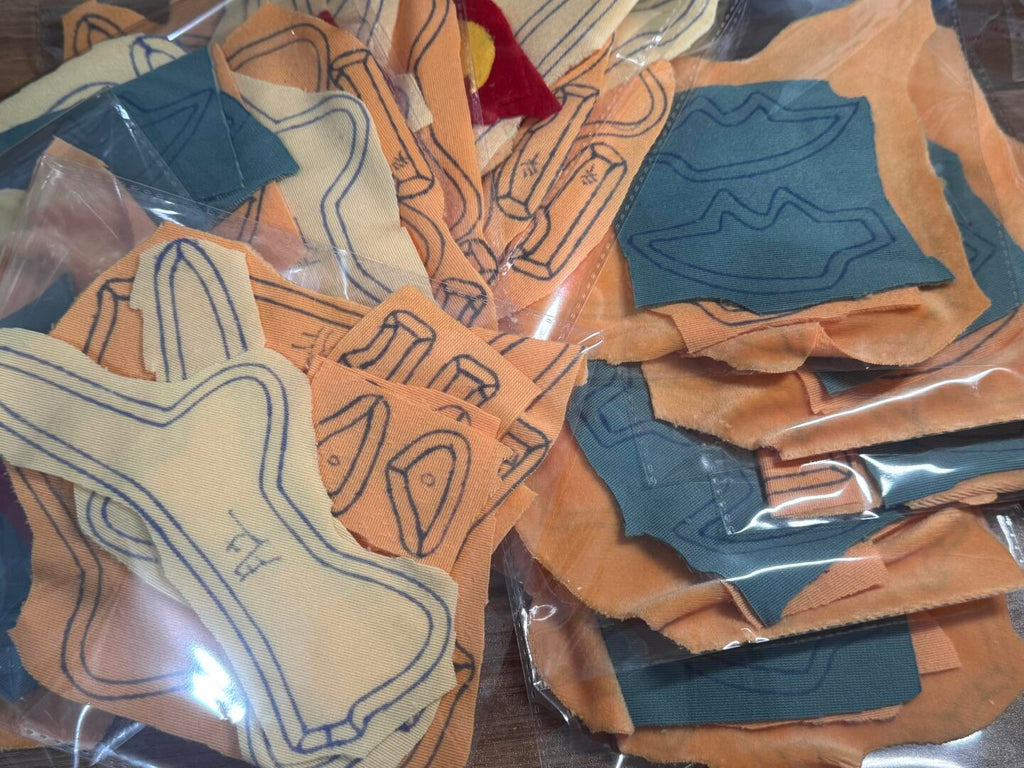 Collection of dragon sewing pattern with geometric designs in clear packaging