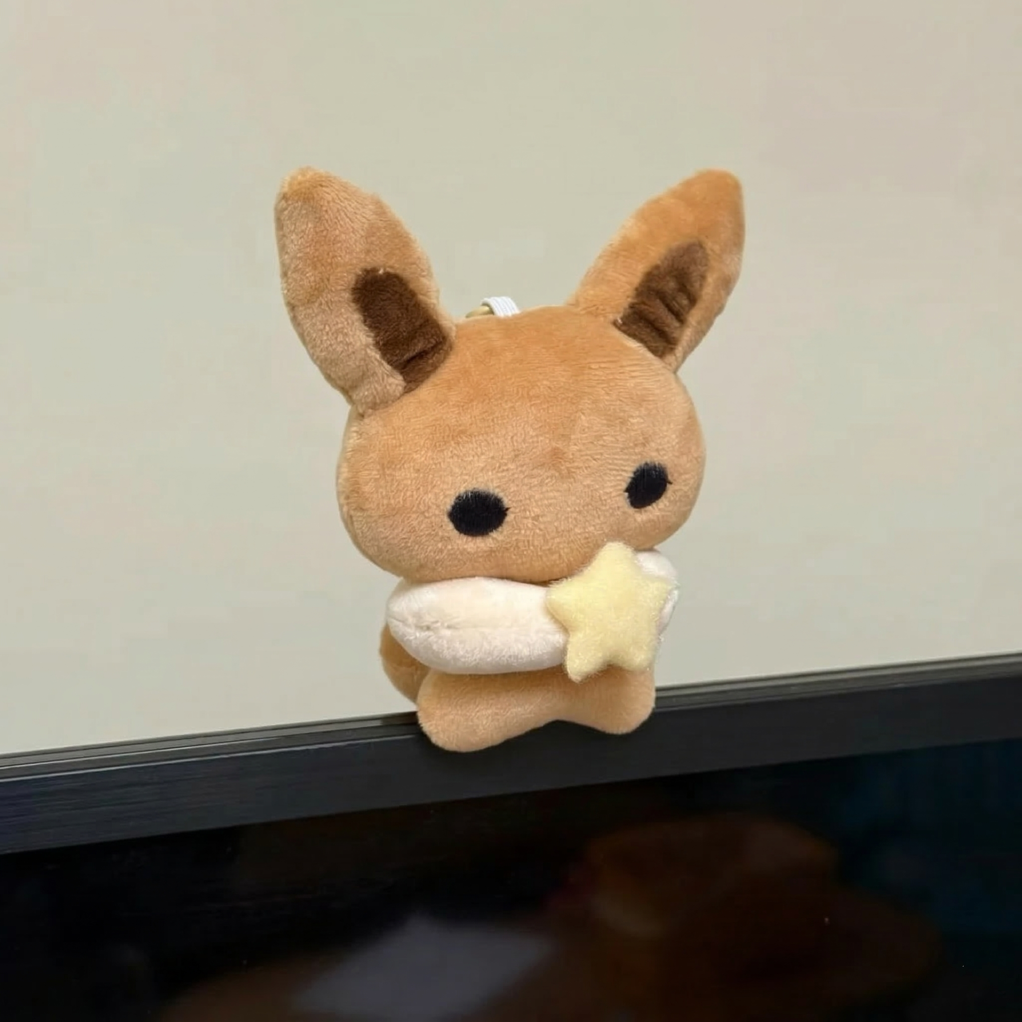 Cute Handmade Eevee Plush toy resembling a fox holding a star, Pokemon plush toy. 