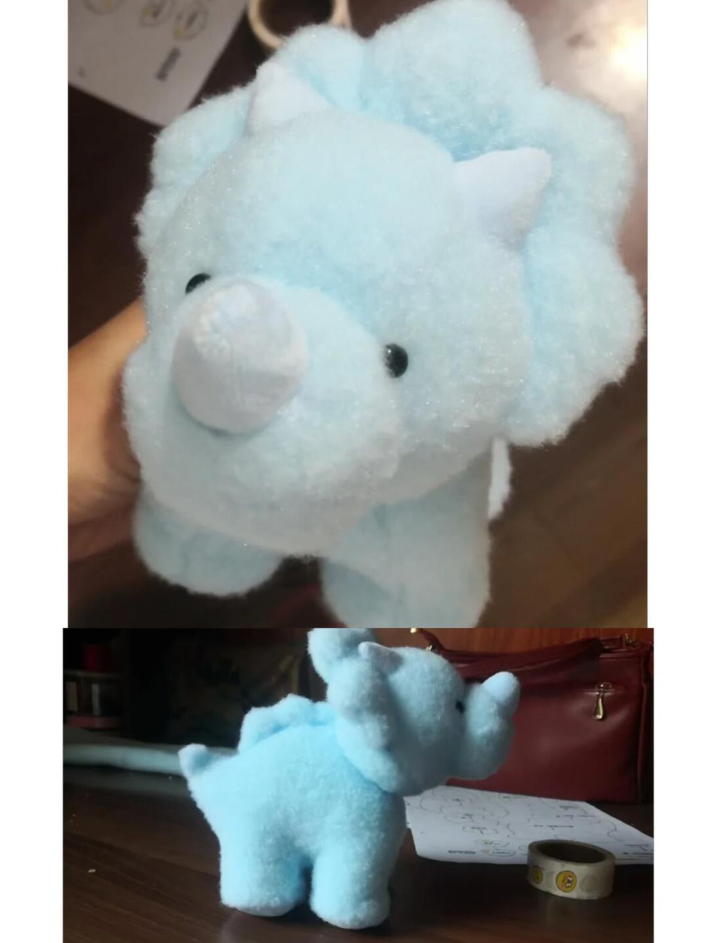 Light blue plush toy dinosaur on a wooden surface