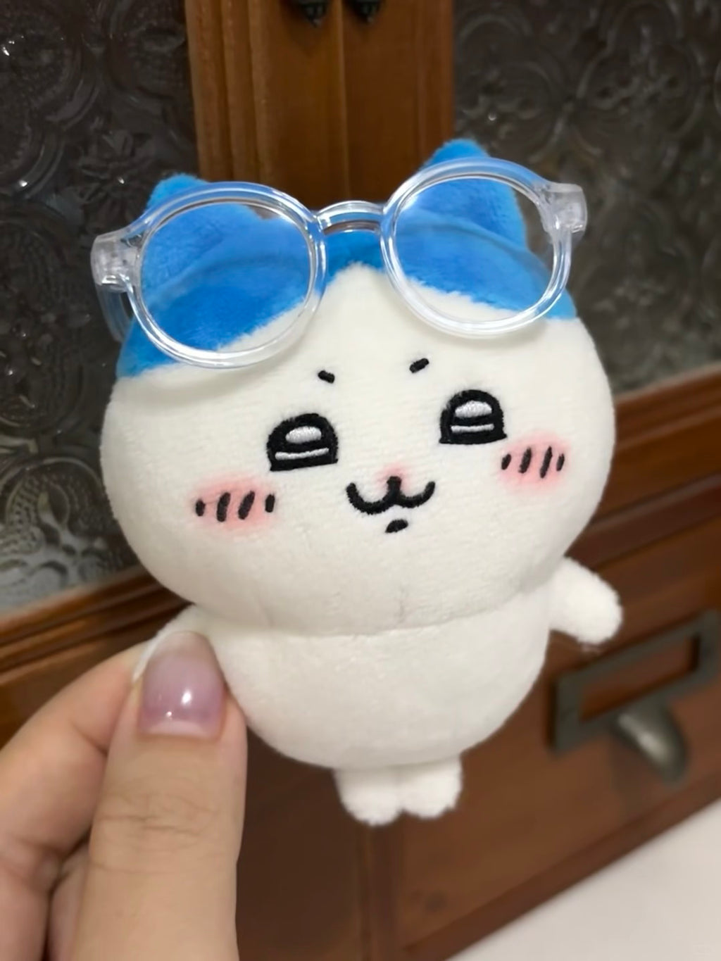 Close-up of handmade Hachiware plush face and blue ear details