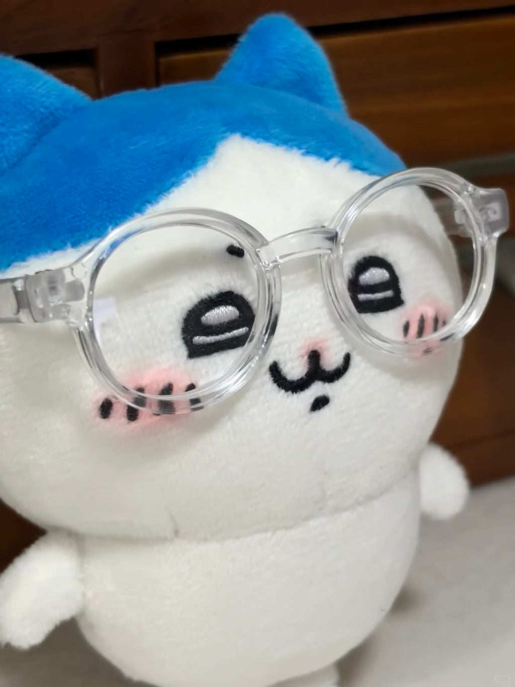 Finished Hachiware plush sewing project held in one hand