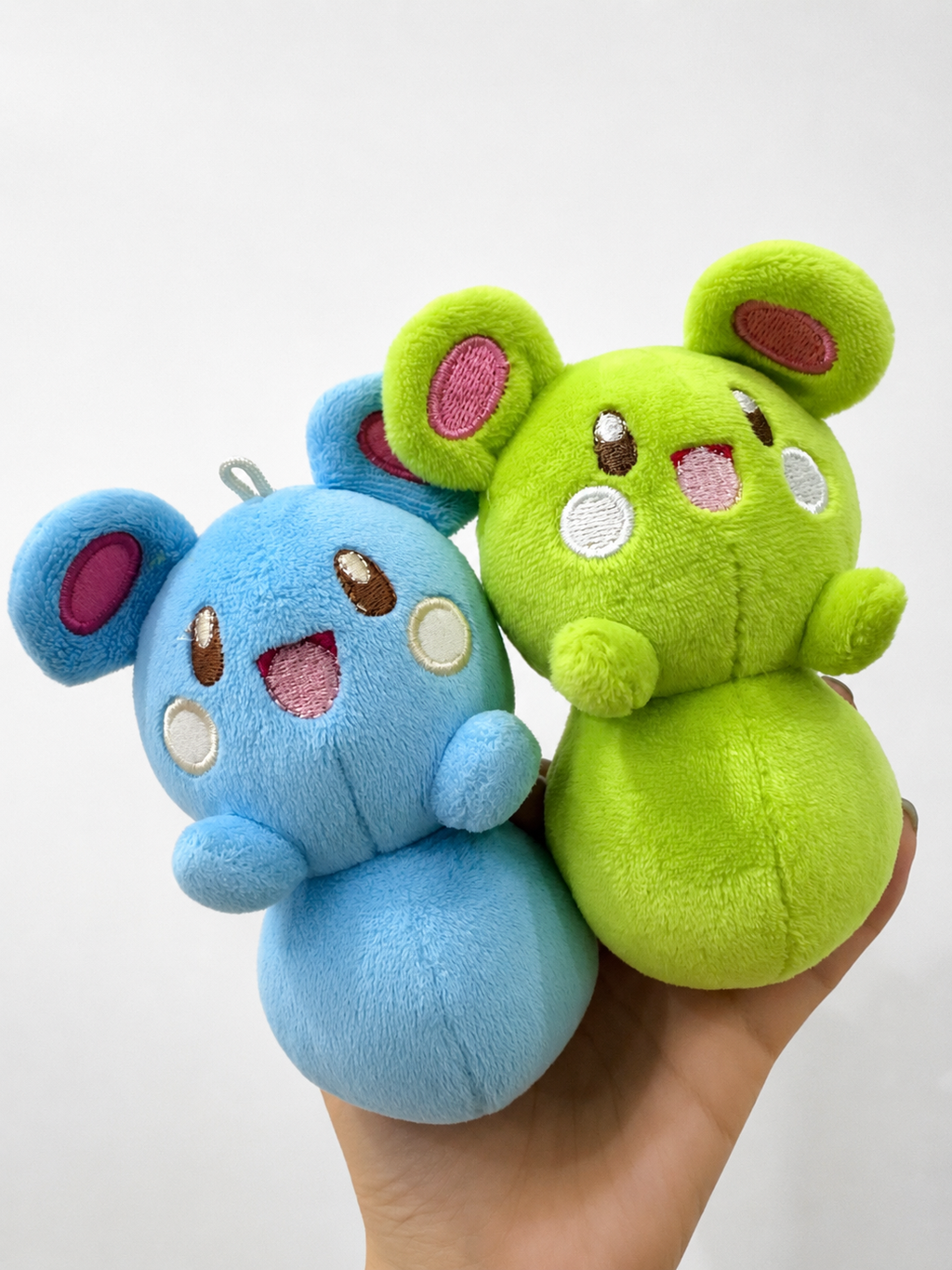 Finished handmade Marill plush in blue and green color variations