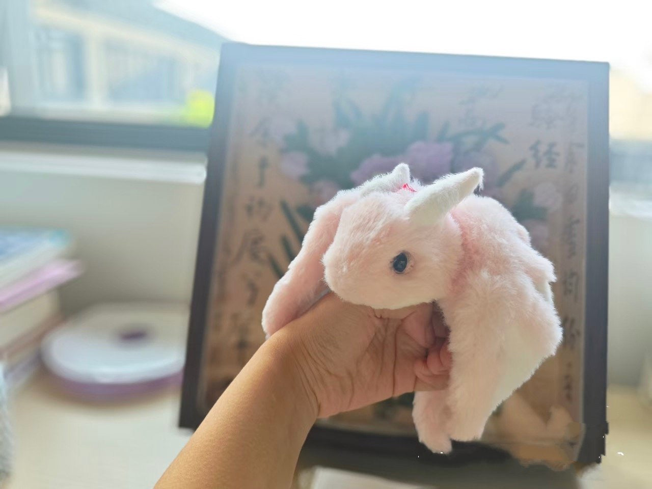 Cute dragon plushie in my hand