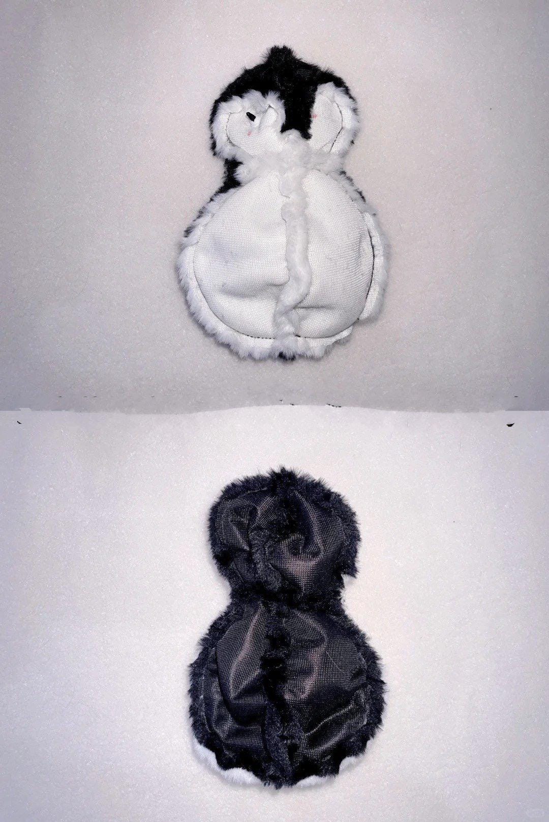 Two plush penguin toys, one white and one black, on a white background.
Plush penguin toy sewing pattern and tutorial