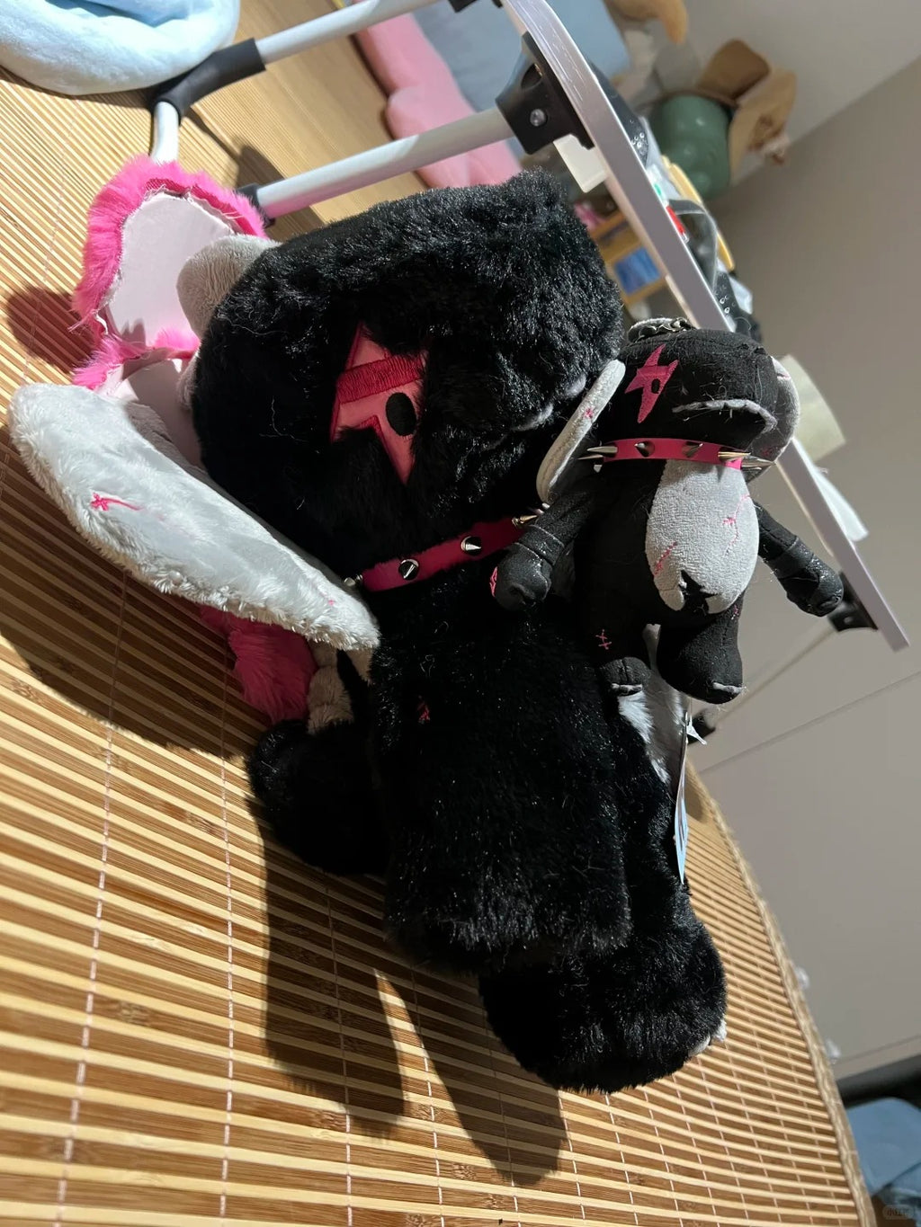Black Boltusk lightning dragon plush color variation with pink accents and white tusks