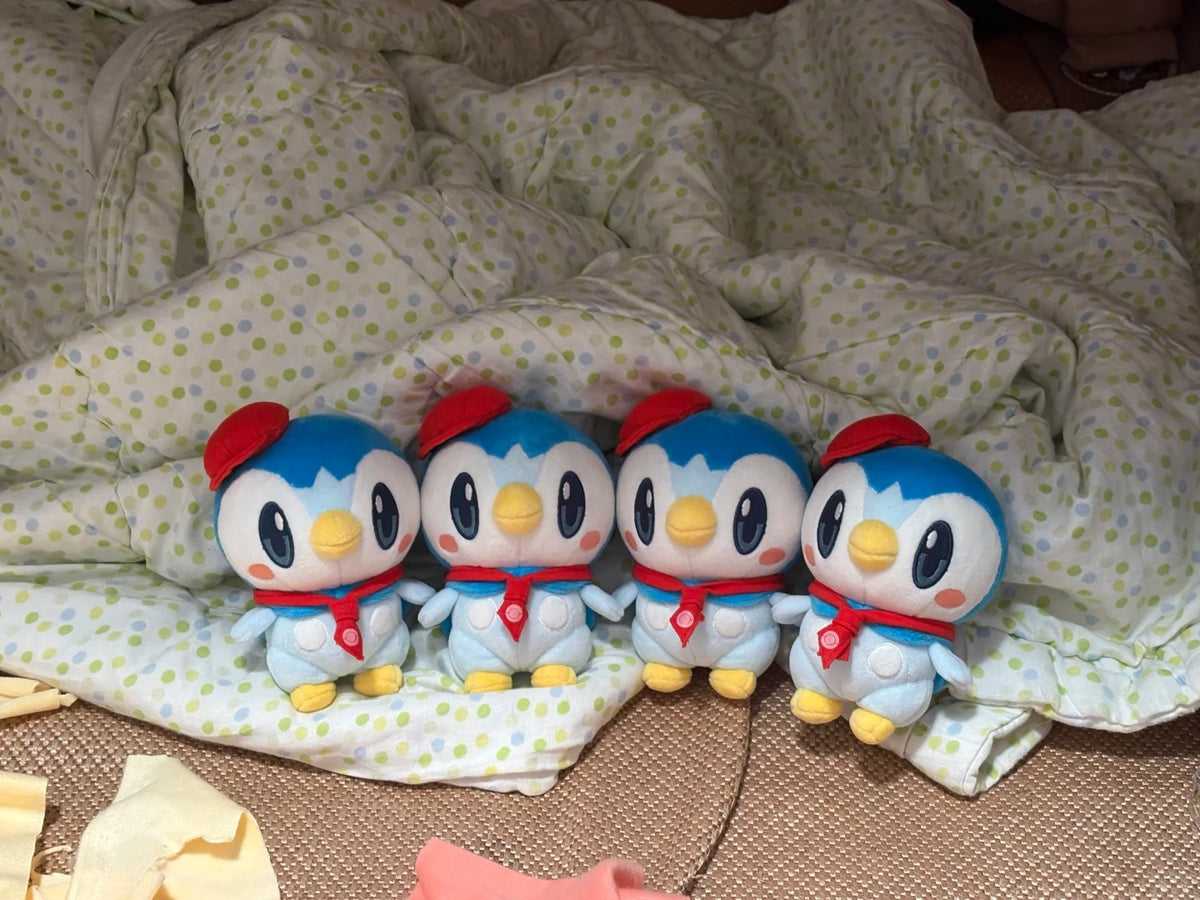 Four finished café Piplup plush dolls lined up together