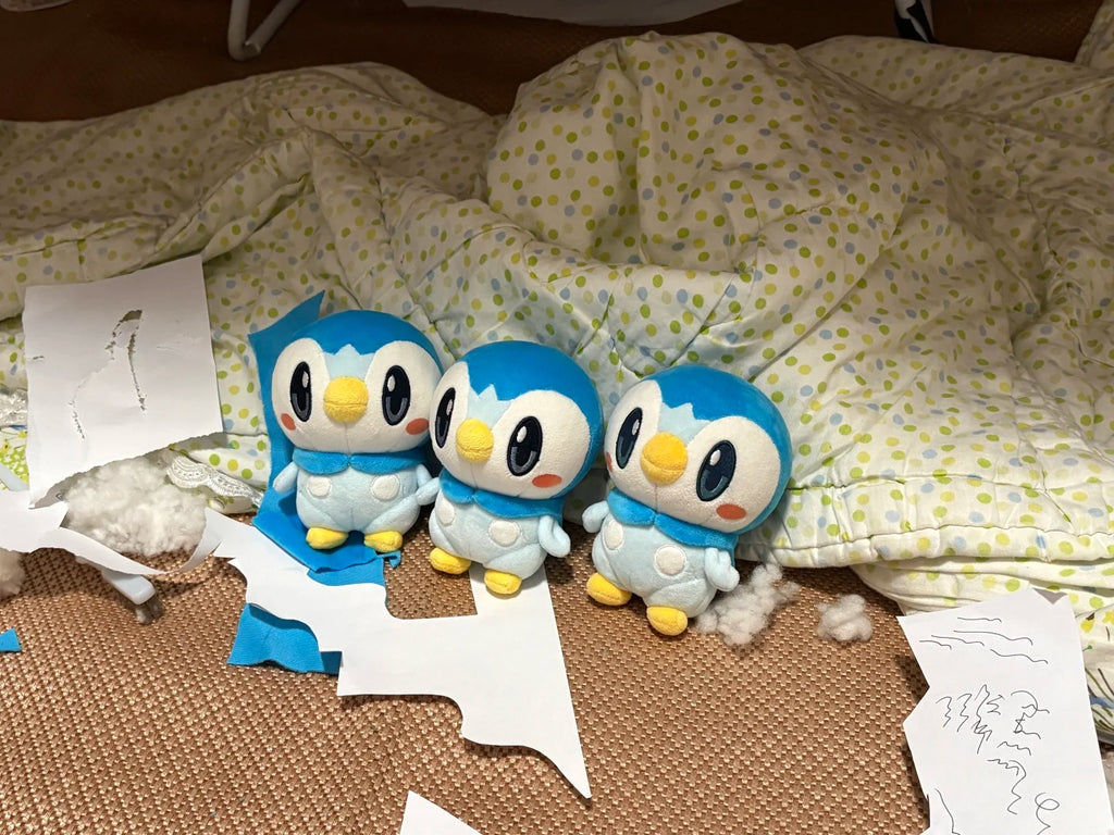 Three unfinished café Piplup plush dolls displayed with paper pattern pieces
