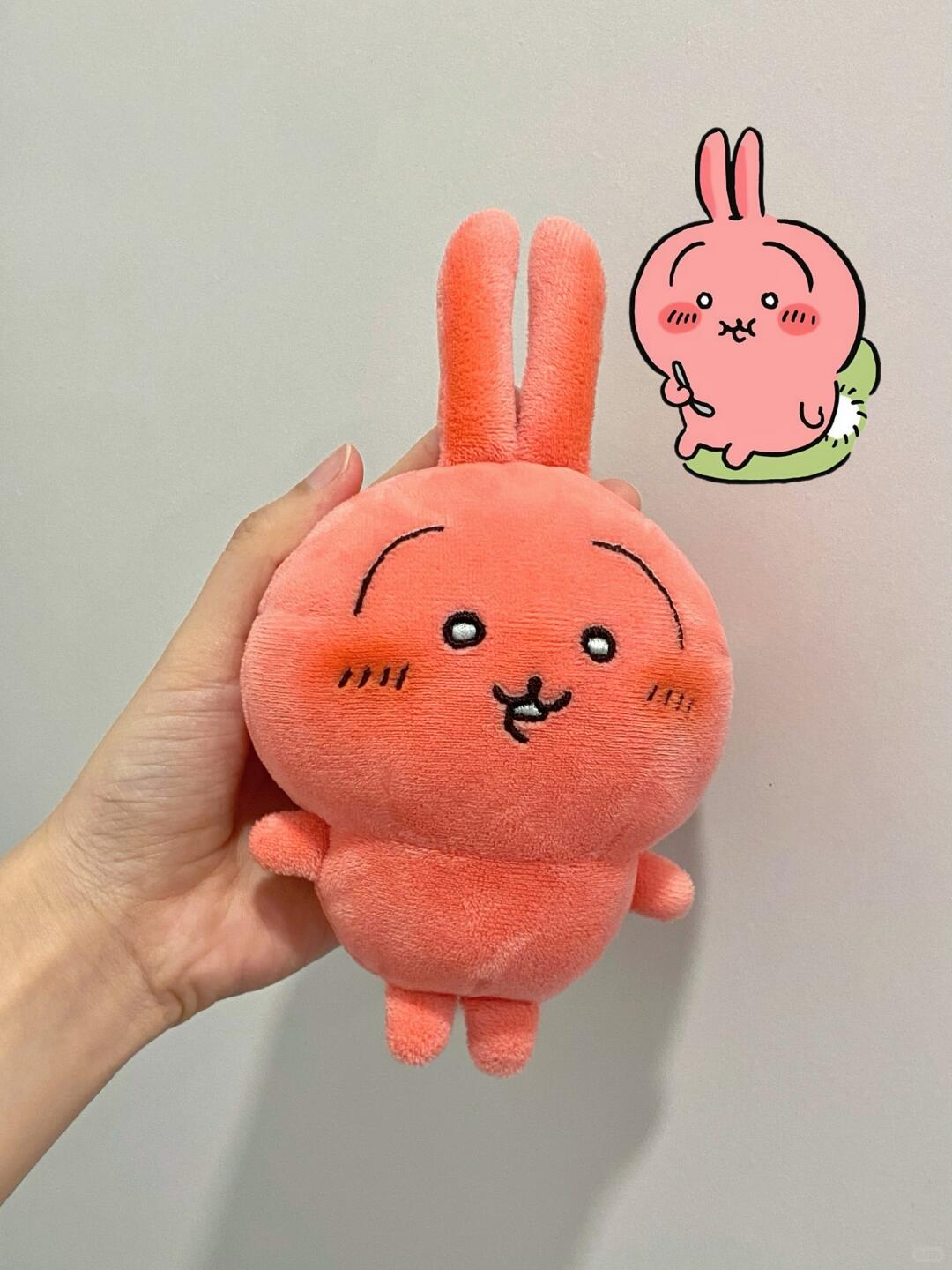 Finished pink Chiikawa-inspired full-body plush held in hand, showing long ears, arms, legs and embroidered face