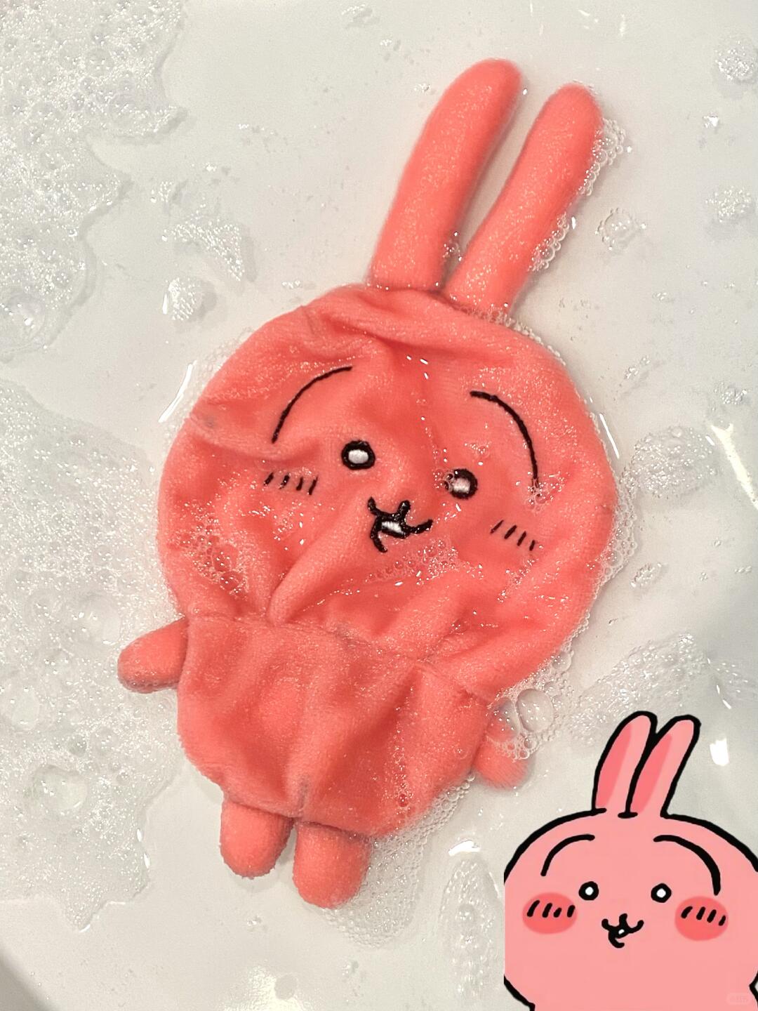 Finished pink Chiikawa-inspired full-body plush in soapy water, showing the completed soft toy construction