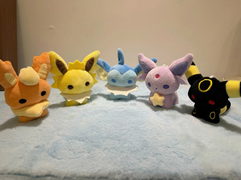 Pokemon Eeveelutions plush sewing pattern bundle featuring Flareon, Jolteon, Vaporeon, Espeon, and Umbreon handmade plush toys