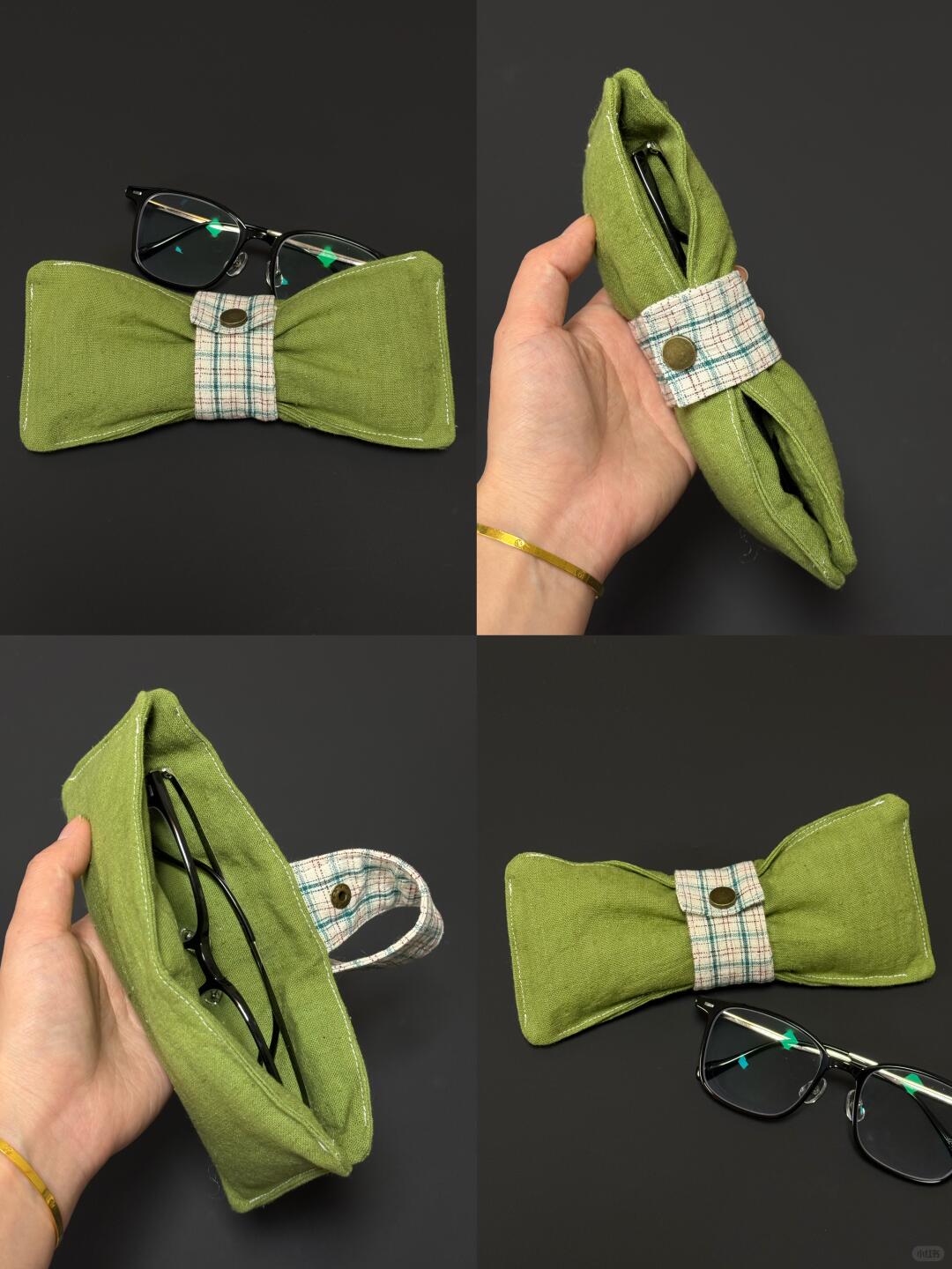 Green fabric bow tie with glasses held by a hand on a dark background