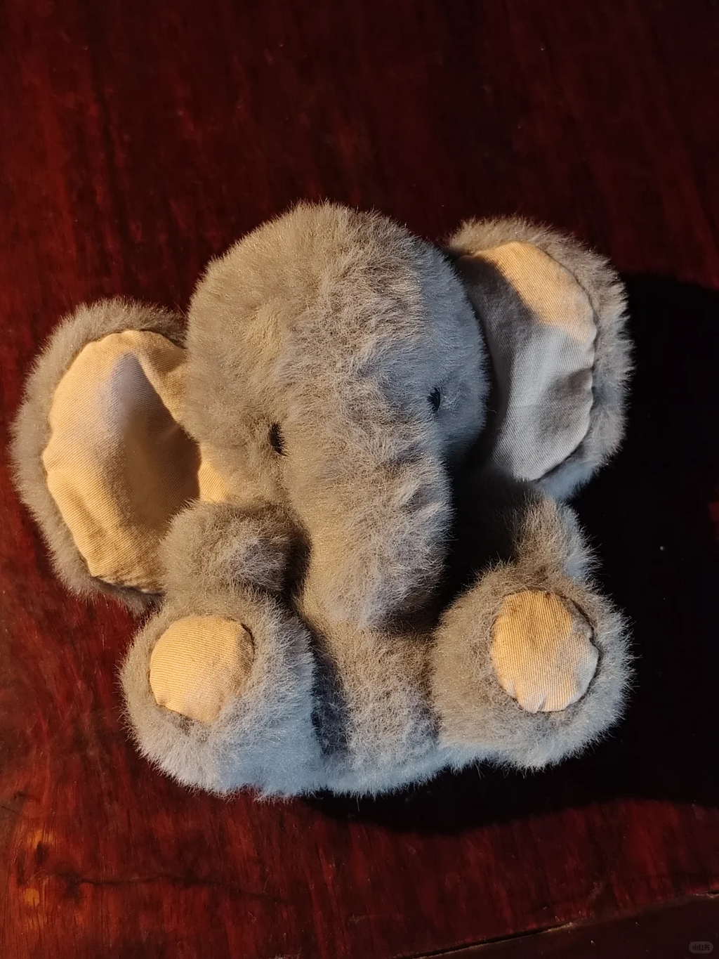 Grey handmade elephant plush with contrasting inner ears and foot pads