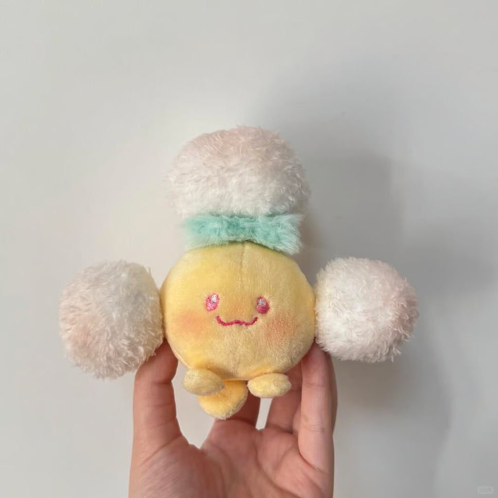 Handmade Jumpluff plush with a round pastel body and fluffy white cotton puffs