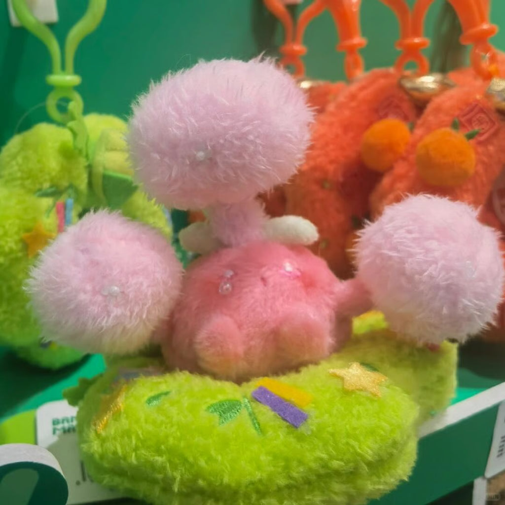 Pastel handmade Jumpluff plush displayed as a cute spring sewing project