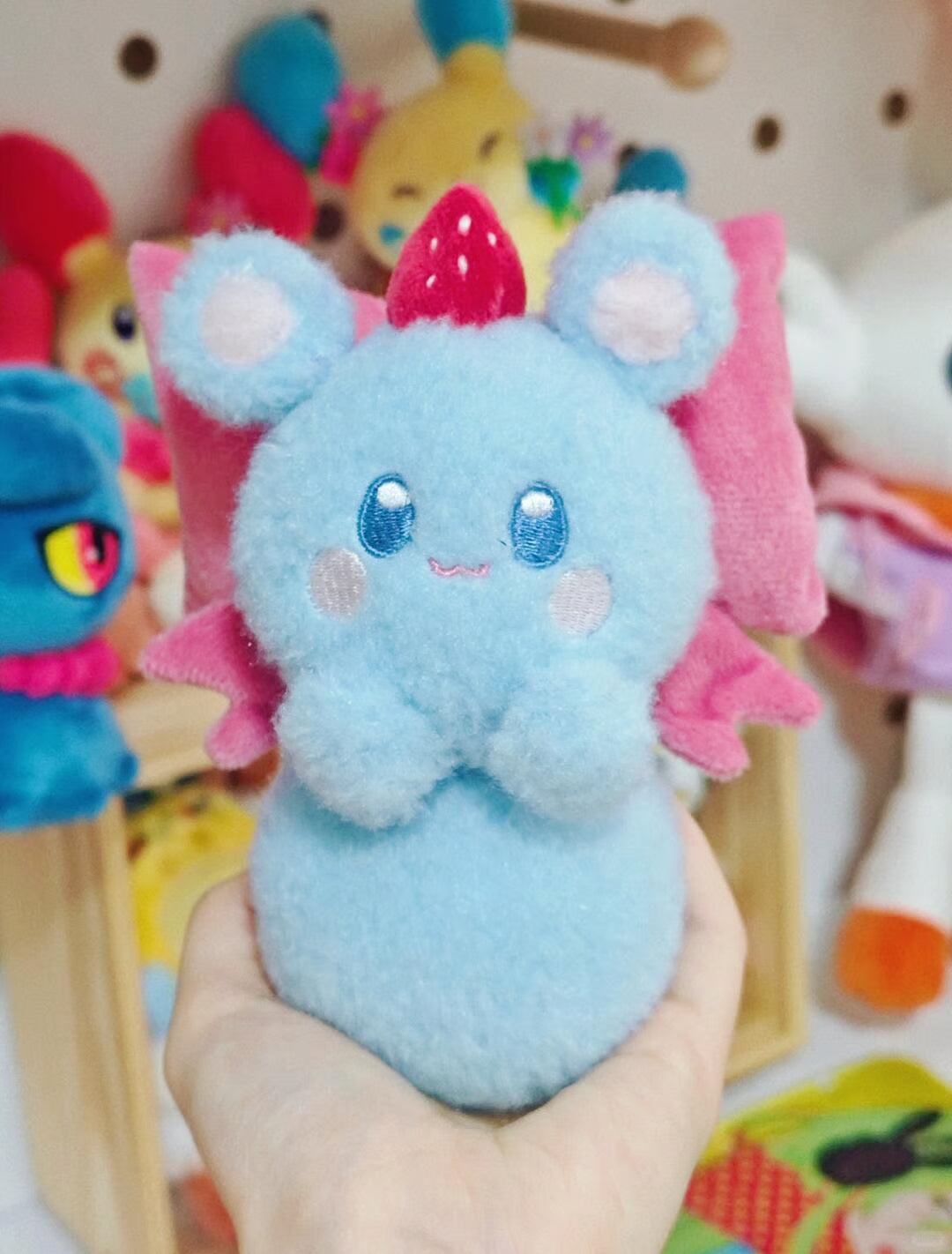 Marill plush sewing pattern PDF shown with a handmade round blue Pokémon-inspired plush