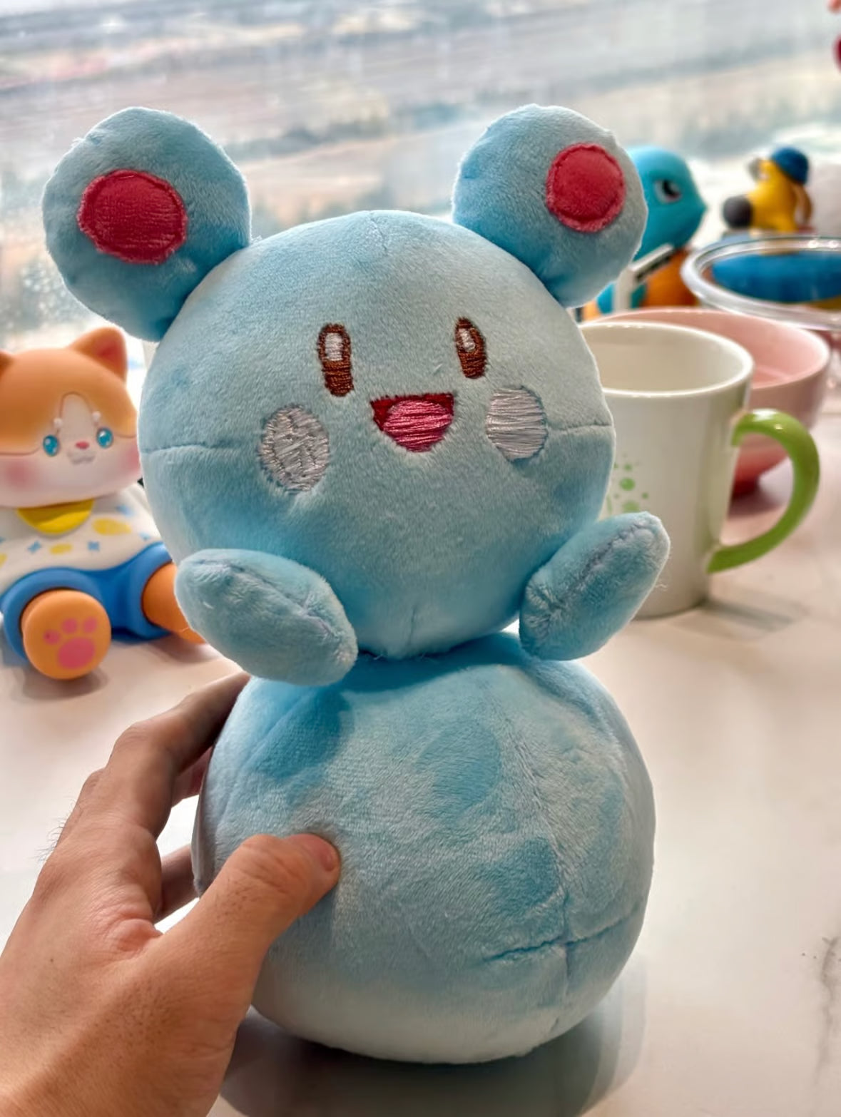 Marill plush sewing pattern result displayed as a palm-sized handmade gift