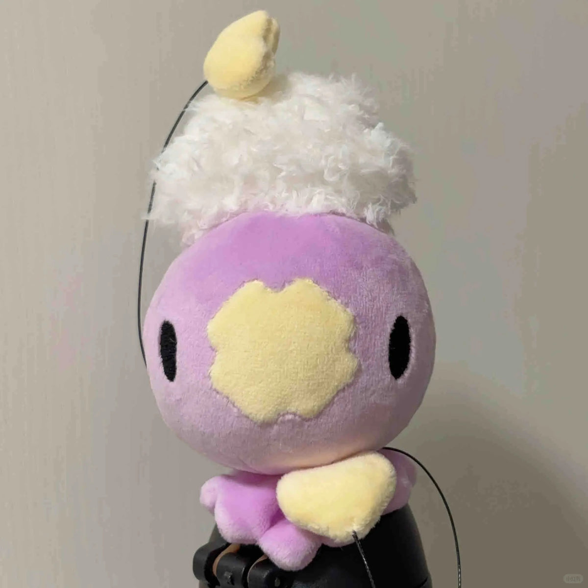 Large lavender Drifloon plush with fluffy white cloud and yellow heart-shaped tip