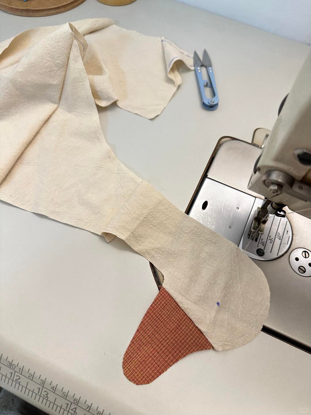Sewing the fabric goose head and beak on a sewing machine