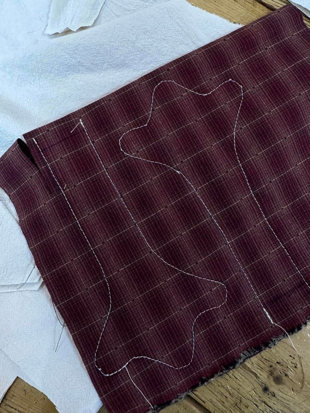 Goose foot pattern traced and stitched on brown checked fabric