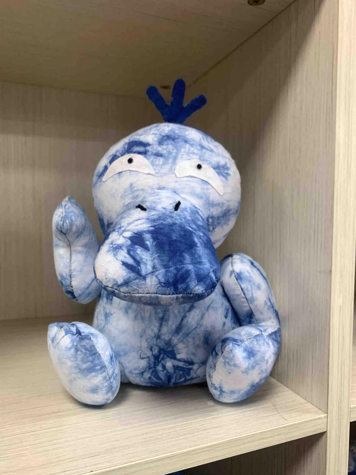 Blue tie-dye Psyduck-inspired plush sewn from fabric