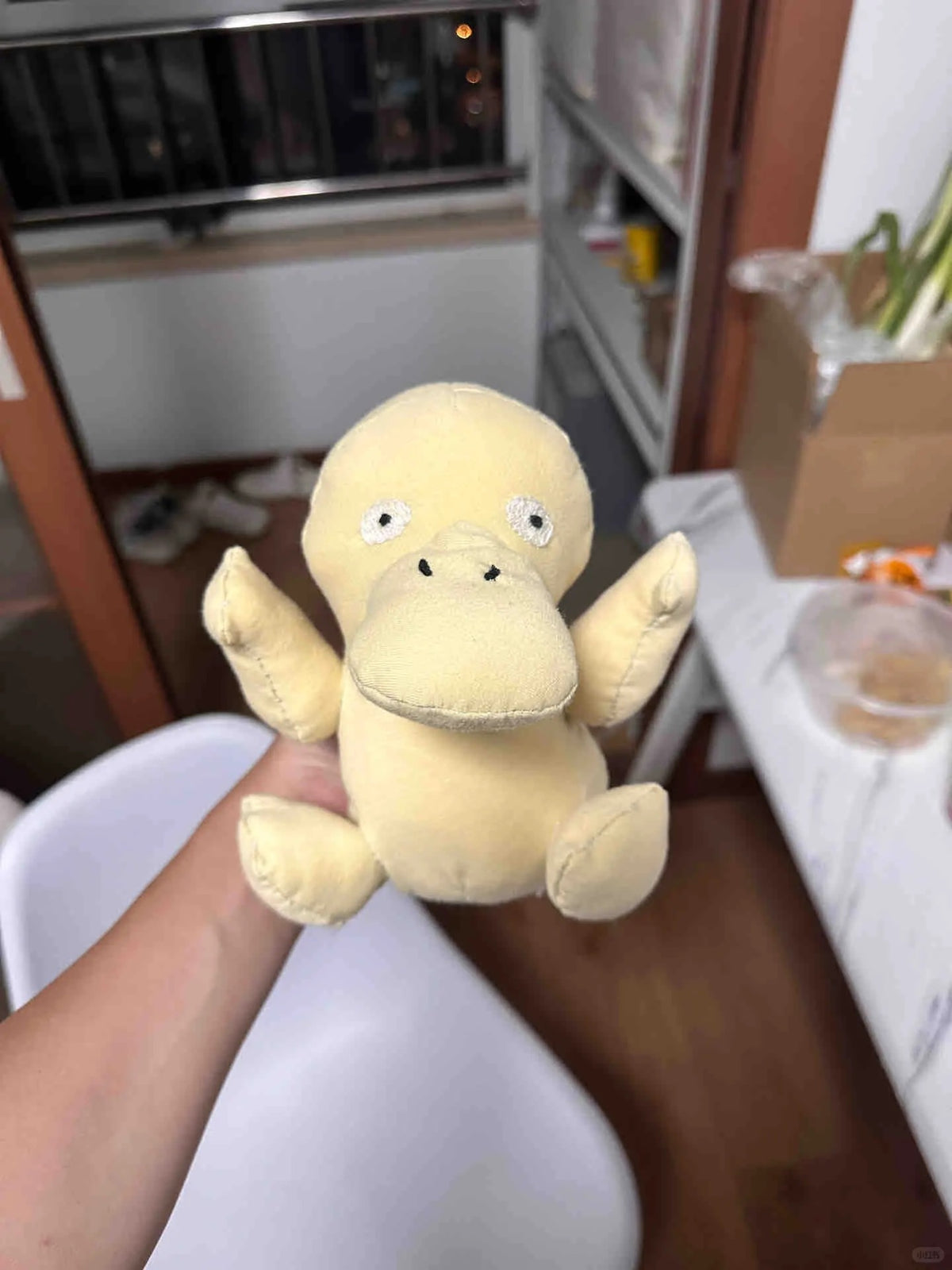 Finished yellow Psyduck-inspired plush made with a sewing pattern